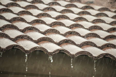 rain falling down from the house roof