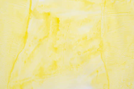 Abstract yellow watercolor background texture close upの写真素材