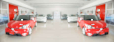 new cars in showroom interior blurred abstract backgroundの写真素材