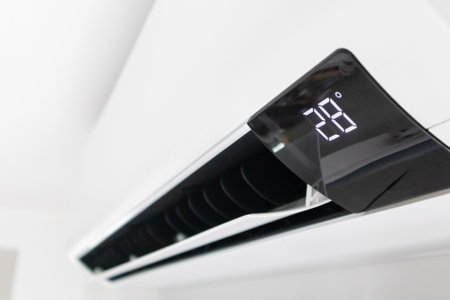 Air conditioner on white wall room interior backgroundの写真素材