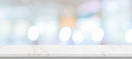 marble table top with blurred kitchen cafe restaurant interior backgroundの写真素材