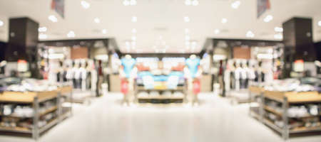 Abstract blur clothing boutique display interior of shopping mall background