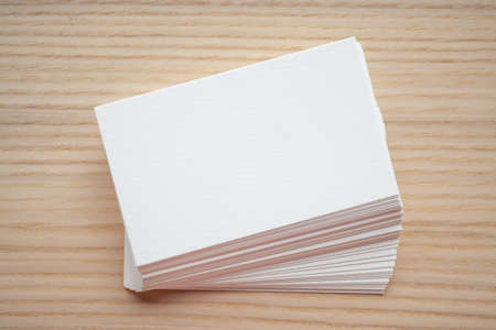 White business card on wood table backgroundの写真素材