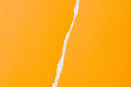 yellow ripped paper torn edges strips backgroundの写真素材