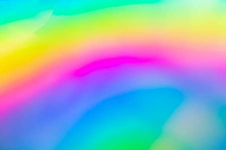 Abstract blur holographic rainbow foil iridescent backgroundの写真素材