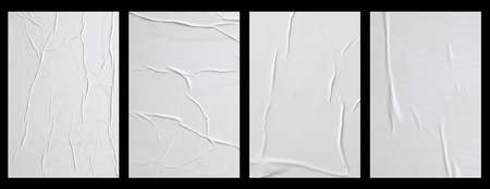 white crumpled and creased glued paper poster set isolated on black background