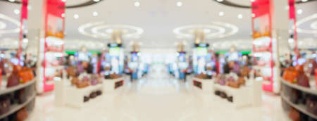 Abstract blur clothing boutique display interior of shopping mall background