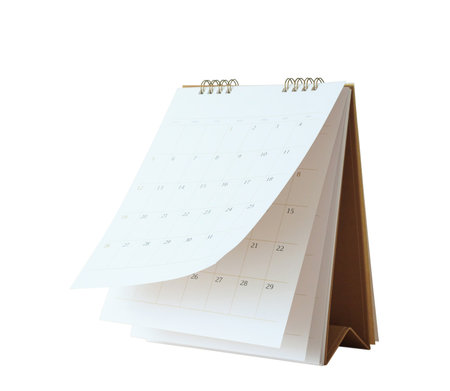 White paper desk calendar flipping page mockup isolated on white backgroundの写真素材