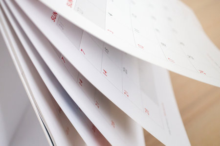 Calendar page flipping sheet close up blur background business schedule planning appointment meeting conceptの写真素材