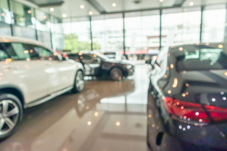 new cars in showroom interior blurred abstract backgroundの写真素材