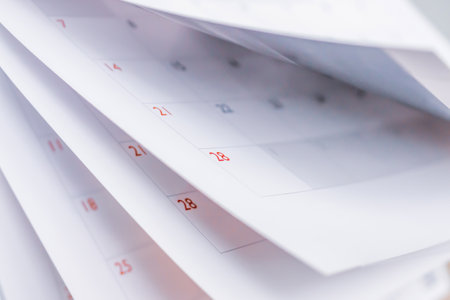 Calendar page flipping sheet close up blur background business schedule planning appointment meeting...
