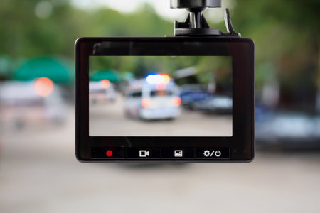 Car CCTV camera video recorder with ambulance car on the roadの写真素材
