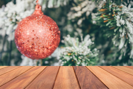 Empty wood table top with blur Christmas tree with bokeh light backgroundの写真素材