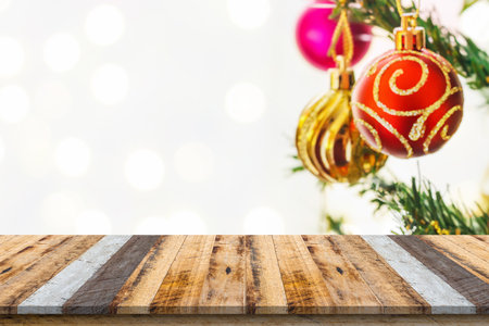 Empty wood table top with blur Christmas tree with bokeh light backgroundの写真素材