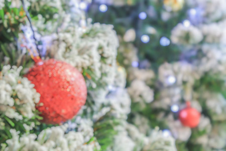 Abstract blurred christmas tree with bokeh light backgroundの写真素材