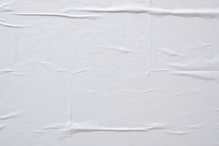 white crumpled and creased paper poster texture backgroundの写真素材
