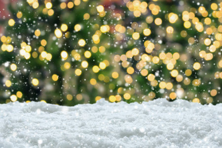 Empty white snow with blur Christmas tree with bokeh light backgroundの写真素材