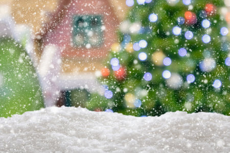 Empty white snow with blur Christmas tree with bokeh light backgroundの写真素材