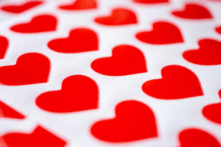 Close up red heart sticker on white paper