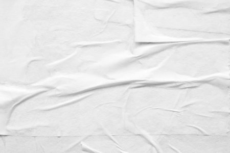 Blank white crumpled and creased paper poster textureの写真素材