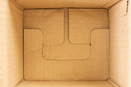 Open empty brown cardboard box background top view