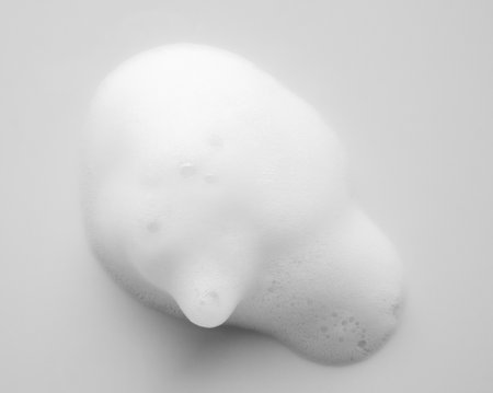 Abstract white soap foam bubbles texture on white backgroundの写真素材