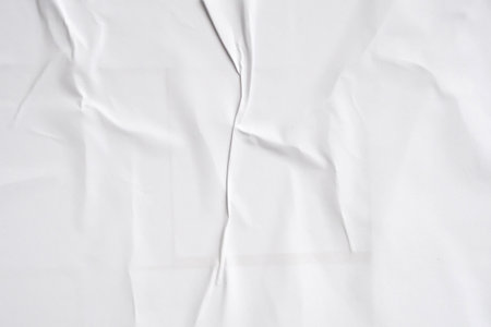 White blank crumpled and creased paper poster texture backgroundの写真素材