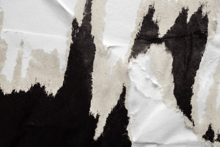Old grunge ripped torn black paper poster surface texture backgroundの写真素材