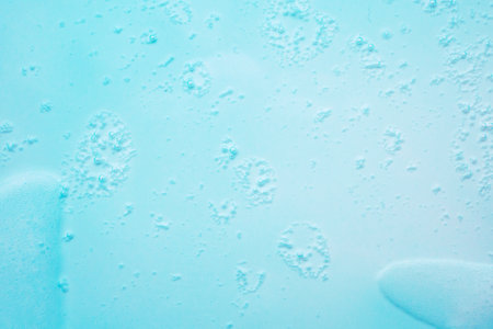 Abstract white soap foam bubbles texture on blue background