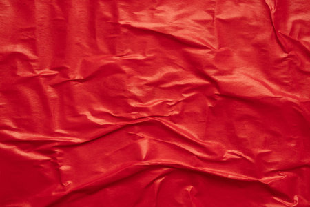 Blank red crumpled and creased paper poster texture backgroundの写真素材