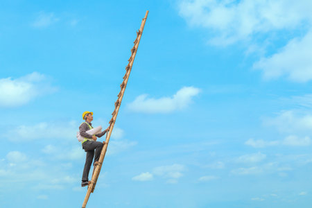 Asian business man engineer climbing up llong adder with blue sky, career growth and success conceptの写真素材