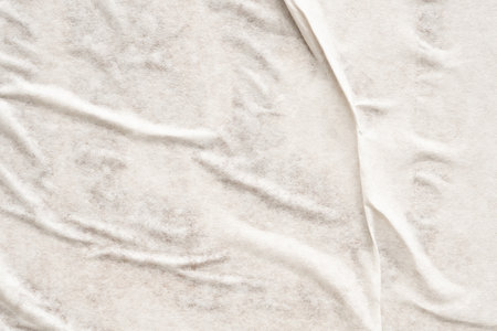 White blank crumpled and creased paper poster texture backgroundの写真素材