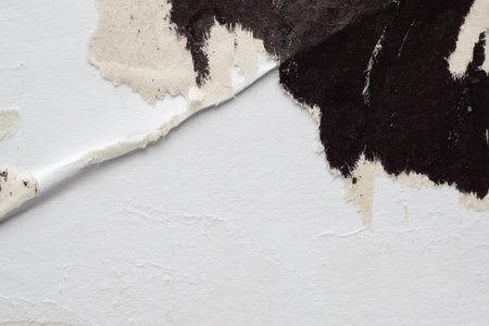 Old grunge ripped torn black paper poster surface texture backgroundの写真素材