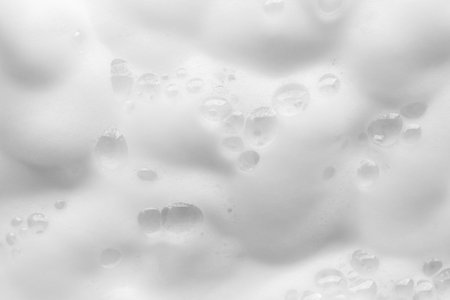 Abstract white soap foam bubbles texture backgroundの写真素材