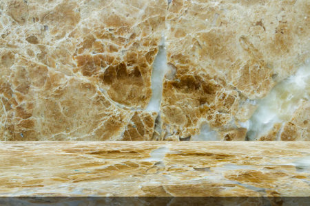Brown marble table top with natural wall texture background for mockup product display templateの写真素材