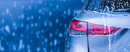 car cleaning and washing with foam soap backgroundの写真素材