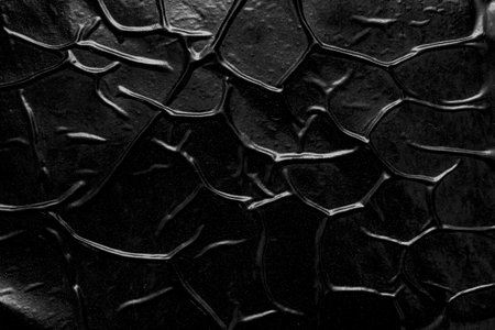 black crumpled and creased plastic poster texture background