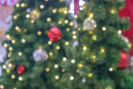 Abstract blurred christmas tree with bokeh light backgroundの写真素材