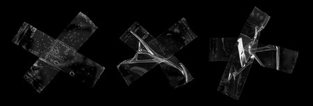 adhesive plastic tape set isolated on black backgroundの写真素材