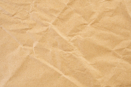 Abstract brown crumpled creased recycle paper texture backgroundの写真素材