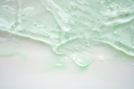 Transparent clear green liquid serum gel cosmetic texture backgroundの写真素材