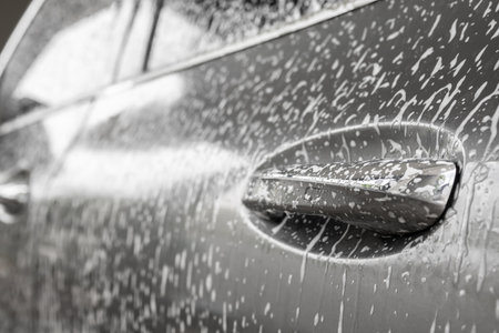 car cleaning and washing with foam soapの写真素材