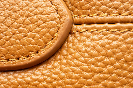 luxury brown leather bag texture background with stitching