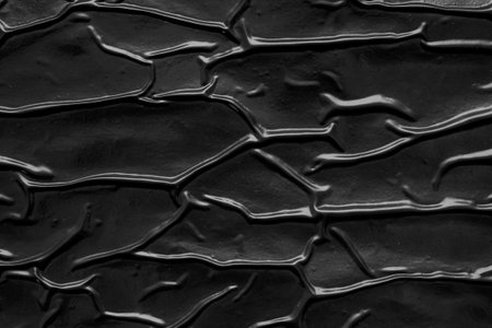 black crumpled and creased plastic poster texture background