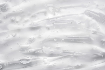 Transparent clear liquid serum gel cosmetic texture backgroundの写真素材