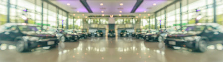 new cars in showroom interior blurred abstract backgroundの写真素材