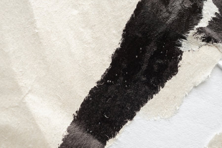 Old grunge ripped torn black paper poster surface texture backgroundの写真素材