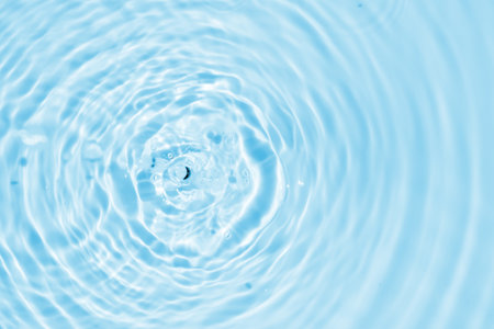 Abstract transparent water shadow surface texture natural ripple on blue backgroundの写真素材