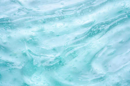 Transparent clear blue liquid serum gel cosmetic texture background