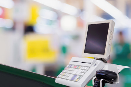 Empty cashier checkout desk with terminal in supermarketの写真素材